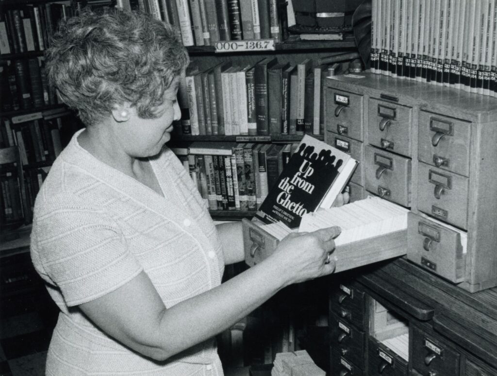 Virginia Y. Lee performing her duties as librarian